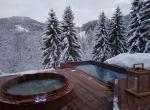 Wood deck luxury chalet with outdoor jacuzzi and outdoor pool les gets france