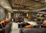 kings-avenue-luxury-chalet-courchevel-001-relaxation-area-with-bar-area