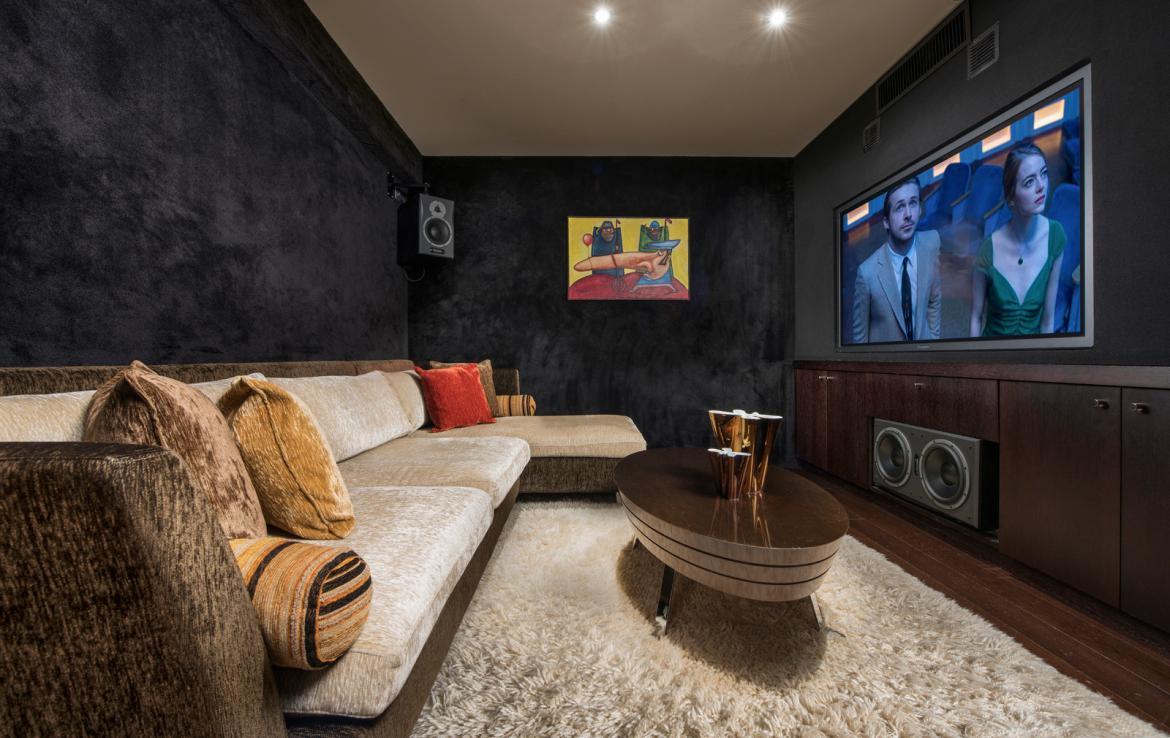 kings-avenue-luxury-chalet-courchevel-003-cinema-room-with-relaxation-area