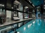 kings-avenue-luxury-chalet-courchevel-003-inside-swimming-pool-with-bar-area