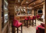 kings-avenue-luxury-chalet-courchevel-005-bar-area-with-tv