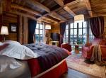 kings-avenue-luxury-chalet-courchevel-005-master-bedroom-with-tv-and-views