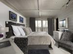 kings-avenue-luxury-chalet-courchevel-007-bedroom-with-tv-balcony-and-views