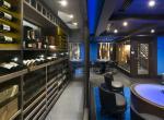 kings-avenue-luxury-chalet-courchevel-009-bar-area-with-wine-cellar