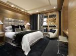 kings-avenue-luxury-chalet-courchevel-009-bedroom-with-balcony