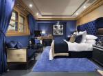 kings-avenue-luxury-chalet-courchevel-009-blue-master-bedroom-with-tv