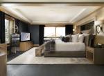 kings-avenue-luxury-chalet-courchevel-009-master-bedroom-with-tv-balcony-and-views